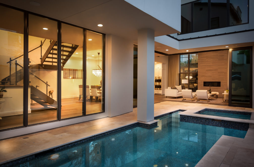 The pool at this Museum District home, built by Frankel Building Group, becomes the perfect architectural accessory for this open air domicile.