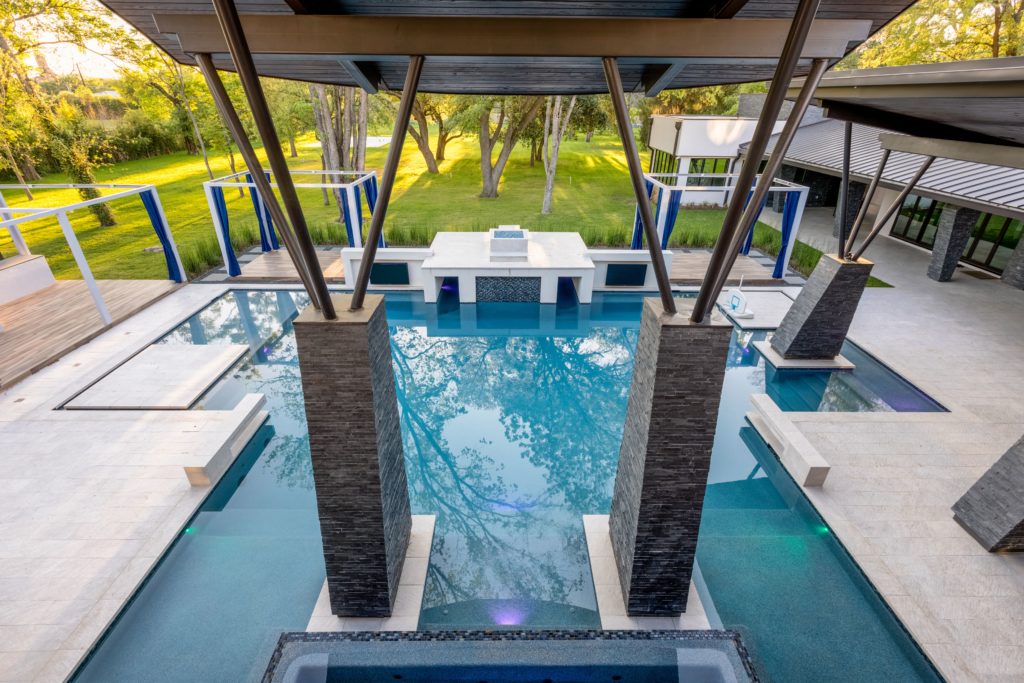 Contemporary architecture with a hint of the brutalist movement calls for a unique pool design such as this one at 3 W. Rivercrest, listed with Susan Boss of Martha Turner Sotheby's International Realty.