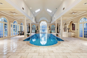 Reminiscent of a grand hotel spa pool in Paris, this is pool number two is just the start of the water play at this 14,000 square foot French Colonial home in Rivercrest., listed with John Daugherty Realtors.