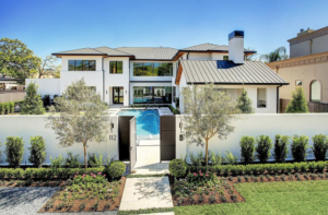 The swimming pool serves as a welcoming water feature at 112 Glenwood new construction home.