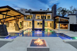 Every modern-day pool feature calls for a fire pit to complete the picture as here at 3 W. Rivercrest.,  designed and built by Frankel Building Group.