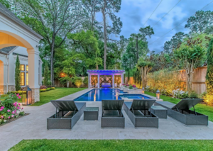 Graceful design, furnishings and landscaping combine for a masterful pool setting a 11611 Windy.