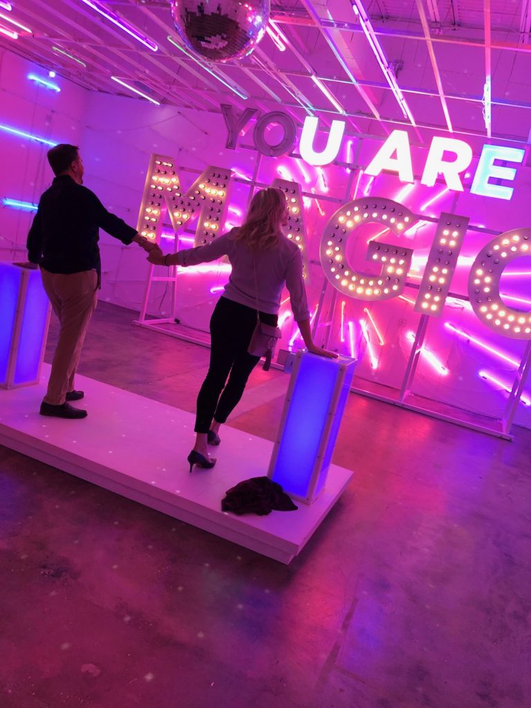 In “Your Magic is Real," two or more people activate a neon wall by placing their hands on sensors that make the room come alive with light, color and music. (Photo by Clifford Pugh)
