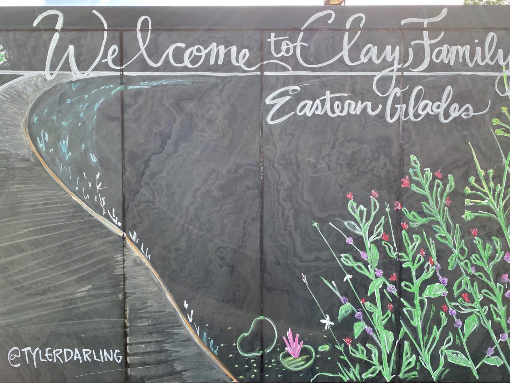 Chalk signage welcomes visitors to the Clay Family Eastern Glades in Memorial Park. (Photo by Memorial Park Conservancy)