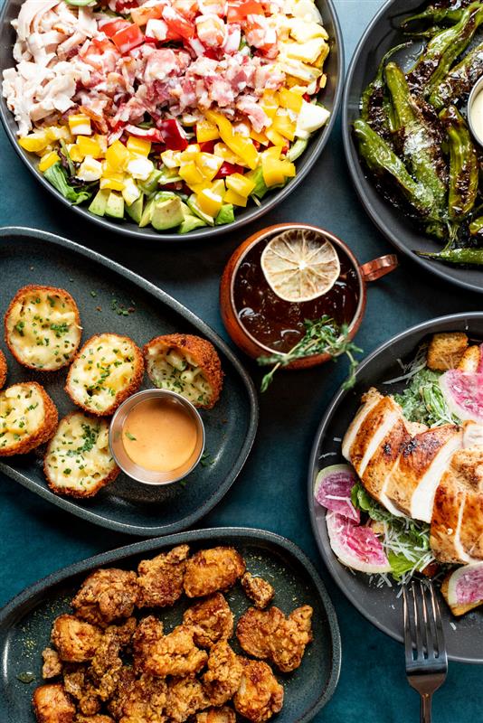 Bites at Electric Shuffle include truffle mac and cheese bites, boneless wings, Cobb salad, and more.