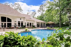 The house at 12014 Tall Oaks sits on more than an acre of tree-shaded land in the heart of Memorial.