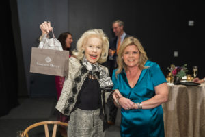 Lynn Wyatt accepts her raffle prize_ photo by Catchlight Group (Photo by CatchLightGroup.com)