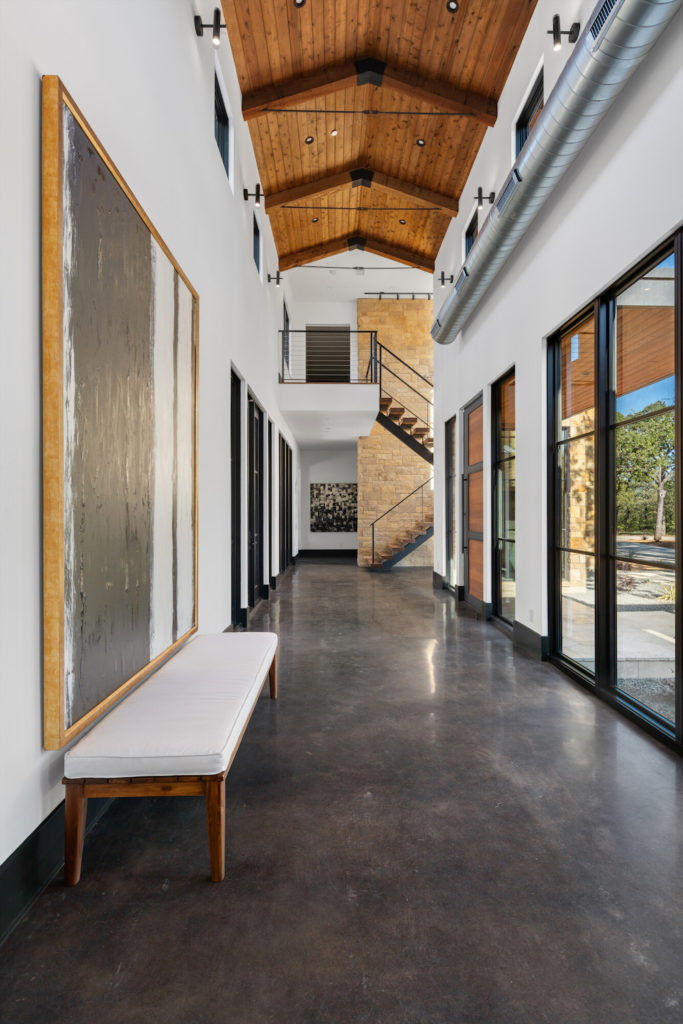 With soaring ceilings and directional lighting, the home doubles as a gorgeous gallery. (Photo by Zach Spross Photography for Douglas Elliman)