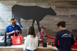 Ryan Cade serves up his customers at R-C Ranch