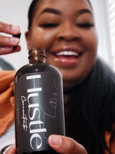 Now Open – Patrice Angwenyi opens a bottle of Hustle Concentrate housemade cold brew from HustleBlendz.