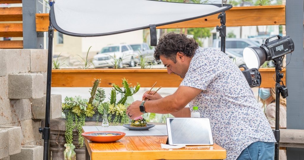 Chef Lanny Lancarte makes sure his Righteous Foods is photo ready. Righteous Food is one of Fort Worth’s Best Vegan Restaurants.