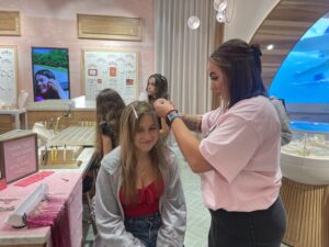 Annabelle Hawrylo, who came from Kingwood with her memaw Terri Pirdy, had tinsel strips put in her hair to celebrate th