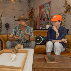 As Patrick Medrano explains the process Shelby Hodge appears a bit worried about sticking her hand in a bucket of goop for a casting. (Photo by Katy Anderson)