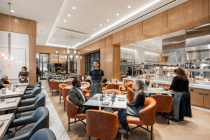 Emelia’s – Just past Emelia’s open kitchen is the Blue Room to the right, and the Circle Bar just beyond.