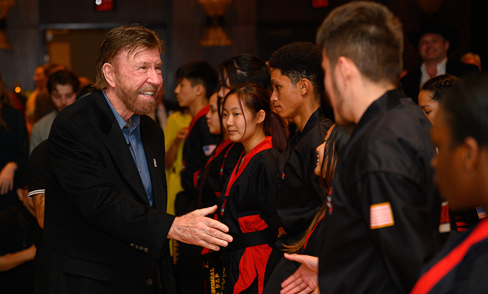 Chuck-Norris-with-Kickstart-Kids-students-after-their-karate-demonstration